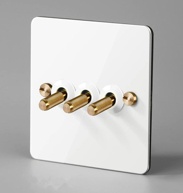 Detailed White & Brass Toggle Light Switch - 3 levers