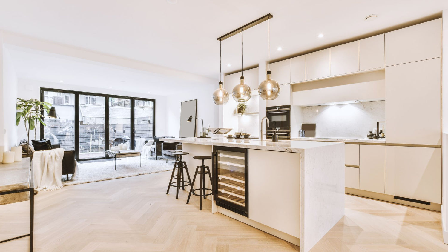 Modern kitchen with gold pendant lights above the island